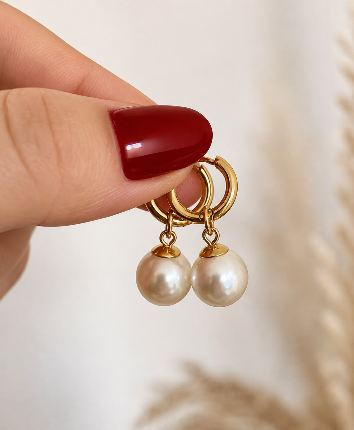 gold plated huggie hoop earrings with round pearl drops